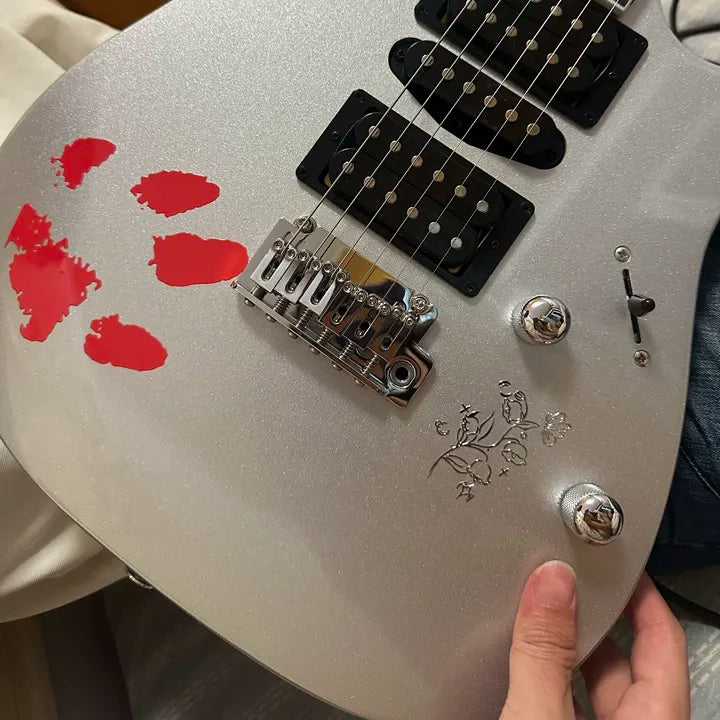 example of using uv dtf stickers on guitars